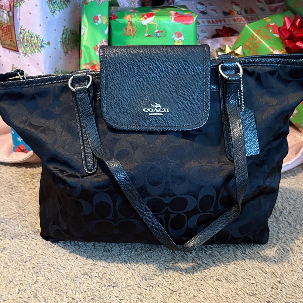 Coach Black Signature purse in excellent condition it is satin material
